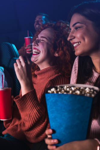 Group,Of,Cheerful,People,Laughing,While,Watching,Movie,In,Cinema.